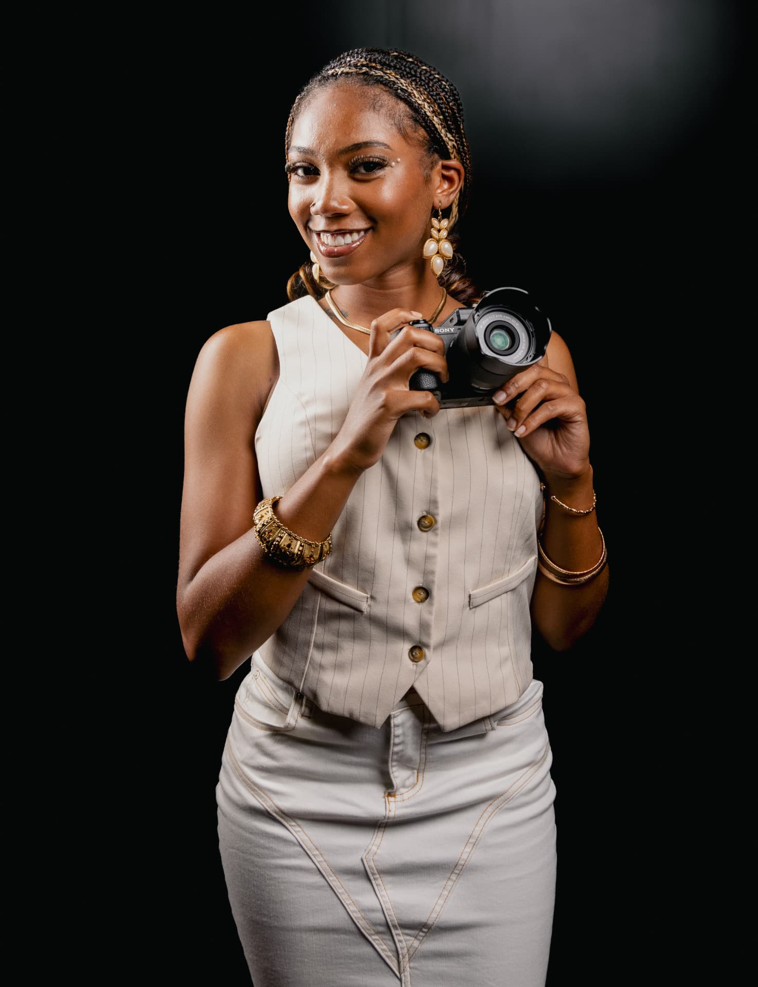 Portrait of founder and Creative Director Milan Italia holding a camera
